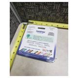 Brother P-Touch TZe Series Standard Adhesive Laminated Labeling Tape - White Print on Lime Green Tape