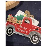 Basket, Red Truck Metal Wall Plaque, Two Tree Ornaments, Three Medium Gift Bags, Seasons Greetings Round Wall Decor, and One Drink Cup