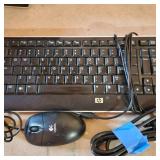 HP Pavillion P6000 series computer, keyboard, mouse and power cord located in basement