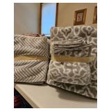 Two sets gray print bath towels, washcloths, hand towels