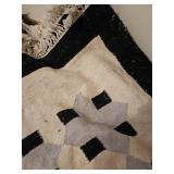 6x8 approximately woven black and white rug, basket of flowers, shower curtain