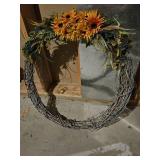 Large wreath made from Barbed wire, with sunflowers