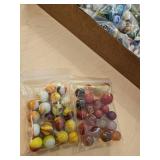 Two bags assorted color vintage marbles, one shooter