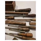 Miscellaneous old tools, chisels, ax head, multi-tools, wouldn