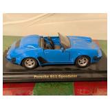 Blue Porsche 911 Speedster and Yellow Porsche 911 Carrera Diecast Cars.