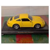 Blue Porsche 911 Speedster and Yellow Porsche 911 Carrera Diecast Cars.