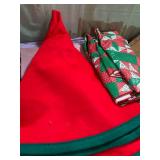 22 inch wide, red and green tree skirt and round plastic tablecloth