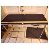 Portable folding table w/adjustable legs