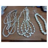 3- White beaded necklaces