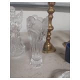 Brass candlesticks and glassware decor