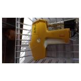 cap gun, security camera, dust buster, glue gun