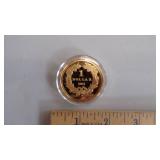 1oz collector coin in clear case - gold in color $1