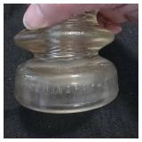 2 electric line insulators glass