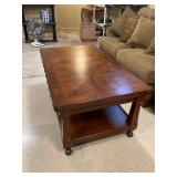 Rolling lift top coffee table 21 x 48 x 28 in (matches lots 904 and 905) (located in basement)