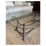 Iron and glass top oval coffee table 17 x 48 x 28 in