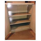 Metal storage cabinet with 2 adjustable shelves. 42 x 36 x 19. Located in the basement