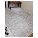 Area rug. 121 x 97. Located in the basement