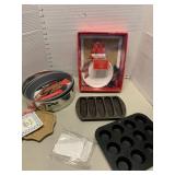 Pampered Chef cookie mold and pie gate, cake pan, cornbread pan, and mini cupcake pan