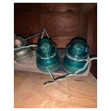 Insulators attached to a 4 x 4 piece of wood â very heavy