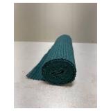 An Open Roll of Shelf Liner, looks like a dark green color