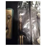 (1) Collectors demi-tasse spoon, (1) Reed & Barton super silver lemon fork and (4) Reed & Barton silver plate spoons & fork.