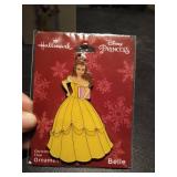 (2) Disney Hallmark keepsakes and (1) Disney princess Hallmark ornament.