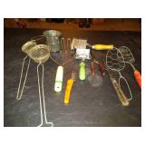 Kitchen utensils, sifters, turkey fork, whisk and vintage potato mashers.