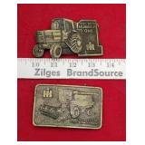 Two international belt buckles