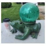 Large ceramic frog with gazing yard ball.