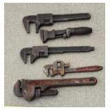 Pipe Wrenches Including Rigid