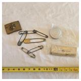 Large safety pins, military memorabilia