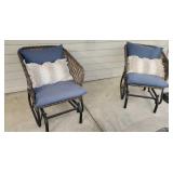 A Pair Of Wicker Gloding Porch Chairs