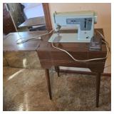 Singer sewing machine with cabinet