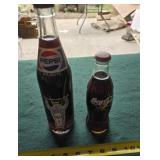 Pepsi and Coca-Cola bottles full