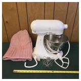 Kitchen Aid mixer with some attachments and cover