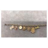 12K GF BRACELET W/ 4 14K CHARMS & 2 10K GOLD CHARM