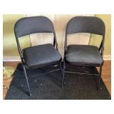 Two Padded Black Metal Folding Chairs