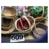 Several baskets and artificial plants