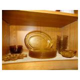 Contents of shelf, amber color glassware, some