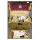 Antique doll trunk with many pairs of doll shoes,