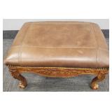 Carved footstool w/ leather upholstery-