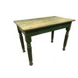 Primitive style table with green paint