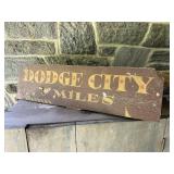 Painted Dodge city miles sign