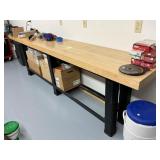 Long narrow work table with solid butcher top.