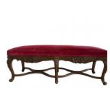 French carved bench with red velvet seat cushion