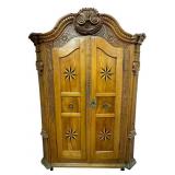 Large two door heavily carved and inlaid antique