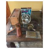 Whiskey box, fish call, knife, belt buckle, Old Timer knife, misc