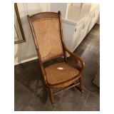 Antique walnut rocker w/ rataan seat