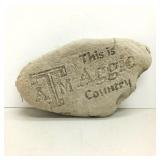 This is Aggie Country garden decor rock