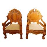 Pair highly carved Indonesian Lion arm Chairs